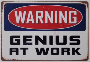 Warning Genius at Work reclamebord van metaal